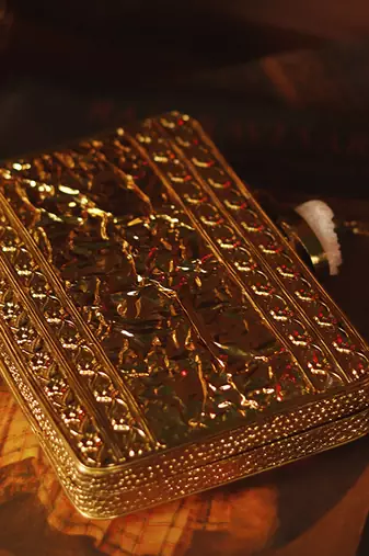 Gold clutch with detachable chain strap