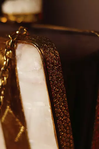 Gold clutch with detachable chain strap