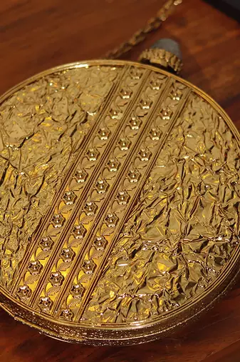 Gold beaded embellished brass clutch
