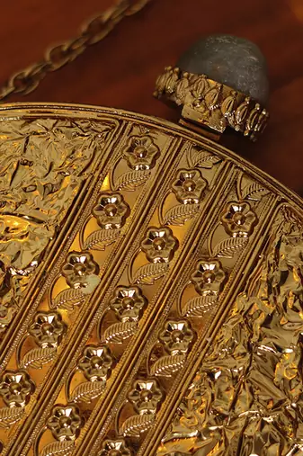 Gold beaded embellished brass clutch