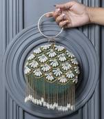 Green hand embroidered silk clutch with tassles