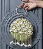 Green silk hand embroidered clutch with tassles