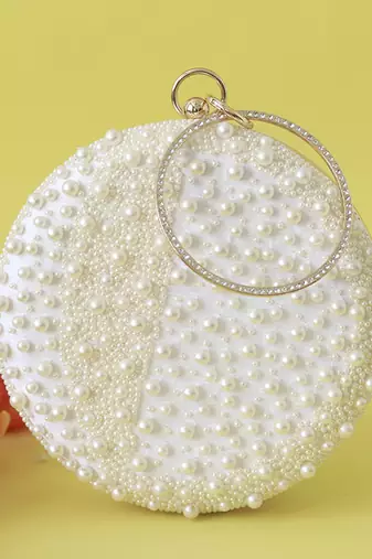 White hand embroidered clutch with pearl details