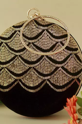 Gold silk clutch with hand embroidered details
