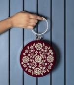 Red silk hand clutch with embroidery details