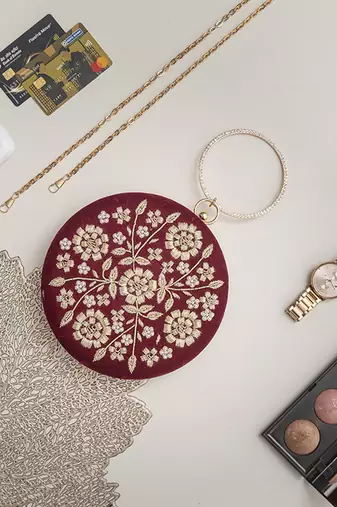 Red silk hand clutch with embroidery details
