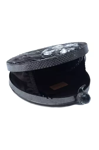 Black round embellished brass clutch