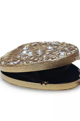 Gold intricate brass clutch