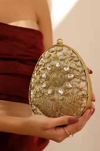 Gold intricate brass clutch