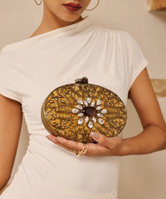 Gold embellished brass clutch with inticrate work 1