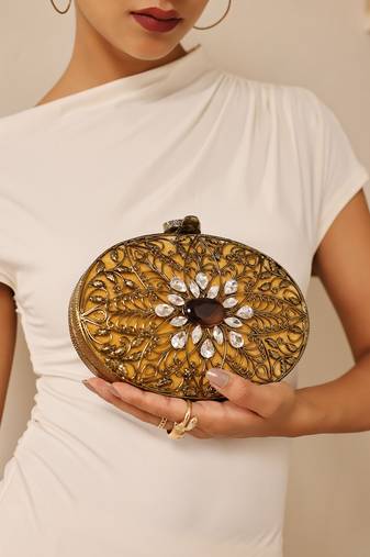 Gold embellished brass clutch with inticrate work