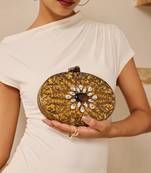 Gold embellished brass clutch with inticrate work