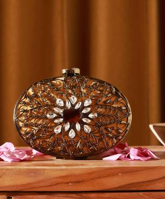 Gold embellished brass clutch with inticrate work 2