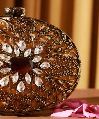 Gold embellished brass clutch with inticrate work 3