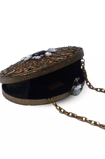 Gold embellished brass clutch with inticrate work