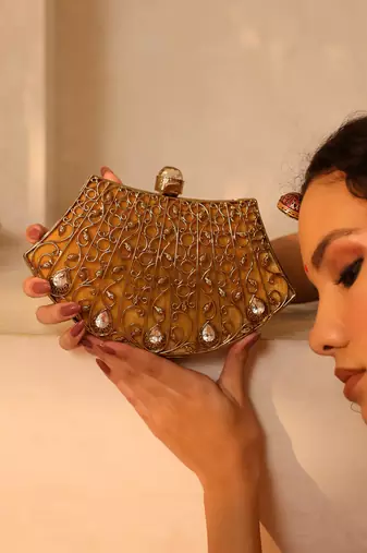 Gold embellished brass clutch
