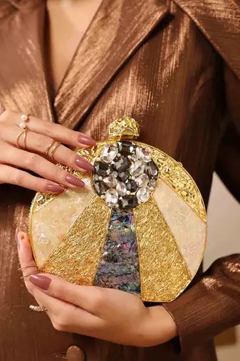 Gold round clutch with detachable chain