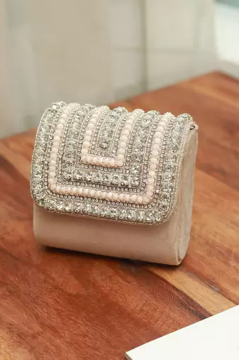 Beige suede mini bag with embroidered handle