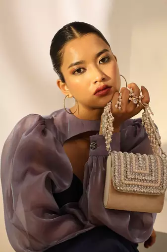 Beige suede mini bag with embroidered handle