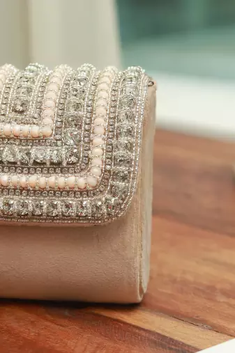Beige suede mini bag with embroidered handle