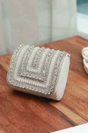White suede mini bag with embroidered handle
