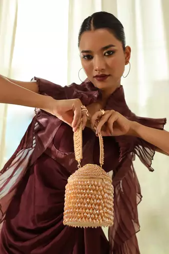 Gold suede round embellished bag with handle