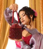 Red suede round embellished bag with handle