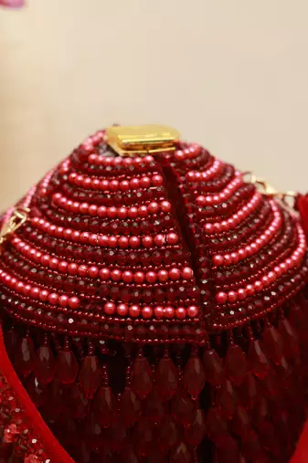 Red suede round embellished bag with handle