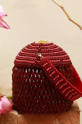 Red suede round embellished bag with handle