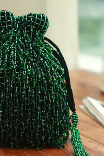 Green suede potli bag with handle
