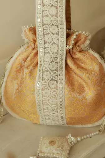 Yellow silk potli bag with handle