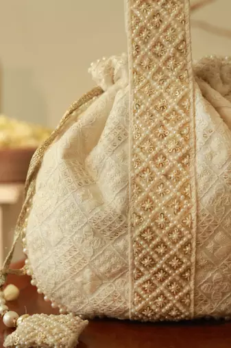 White silk taj embroidered potli bag with handle