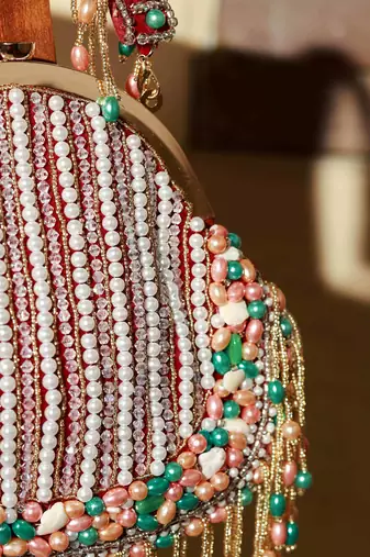 Red clutch with detachable chain