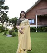 Yellow fancy saree with embroidered blouse