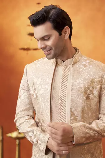 White raw silk embroidered jacket paired with sleeveless vest & pant