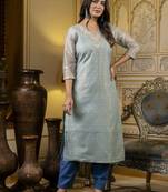 Green embroidered shimmer silk salwar suit