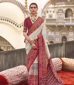 Off white poly viscose silk ikkat printed patola saree with red weaving  border