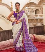 Off white poly viscose silk ikkat printed patola saree with plum weaving  border