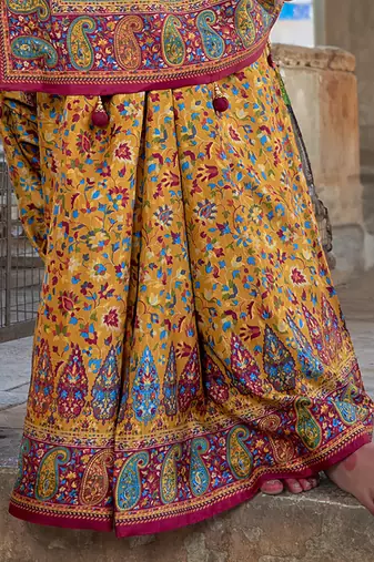 Orange poly viscose silk floral printed pashmina saree with paisley design border