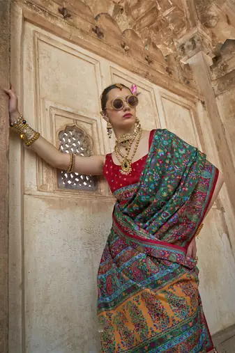 Dark green poly viscose silk floral printed pashmina saree with paisley design border