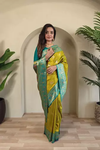 Lemon yellow Banarasi silk blend saree with zari weaving Meenakari design