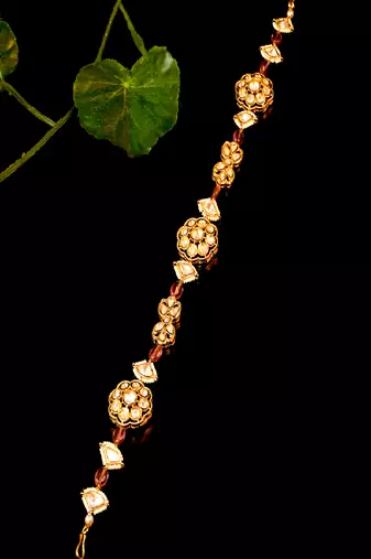 Elegant kundan floral matha patti with bead accents