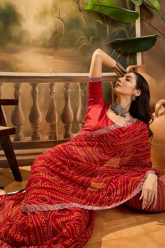 Women's red georgette bandhani saree with unstitched blouse piece