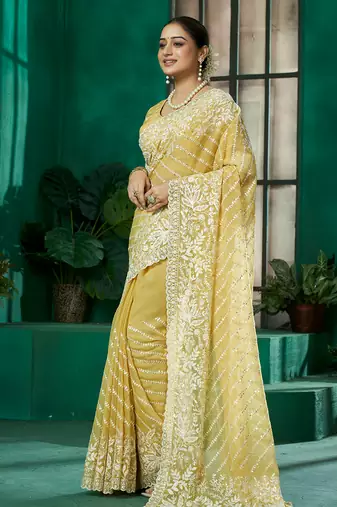 Yellow organza woven embroidered saree