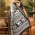 Women's black silk cotton printed saree with unstitched blouse piece