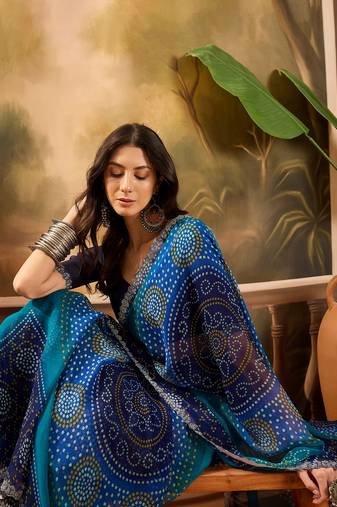 Women's blue georgette bandhni saree with unstitched blouse piece