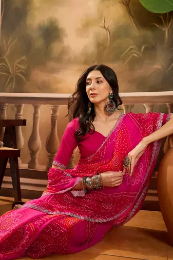 Women's pink georgette bandhni saree with unstitched blouse piece