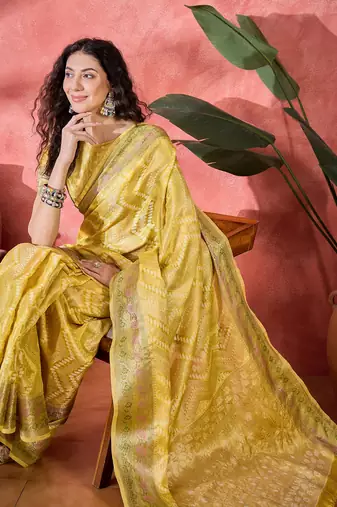 Women's yellow silk blend rangkat bandhani work saree with unstitched blouse piece
