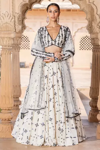 BEIGE SEQUIN EMBROIDERED SILK A LINE LEHENGA CHOLI WITH DUPATTA.