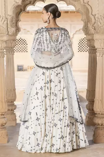 WHITE SEQUIN EMBROIDERED COTTON SILK A LINE LEHENGA CHOLI WITH DUPATTA.
